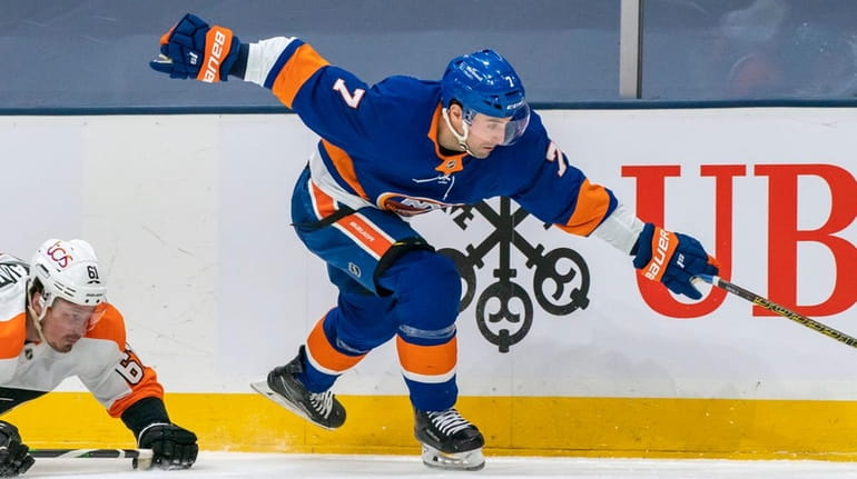 Islanders right wing Jordan Eberle skates past Flyers defenseman Justin Braun during...