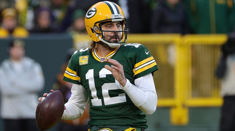 Aaron Rodgers of the Packers looks to pass the ball during...