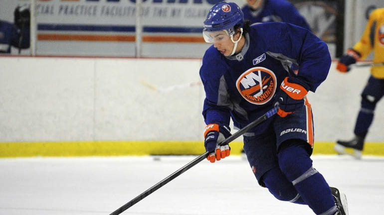 Travis Hamonic skates during the New York Islanders training camp....