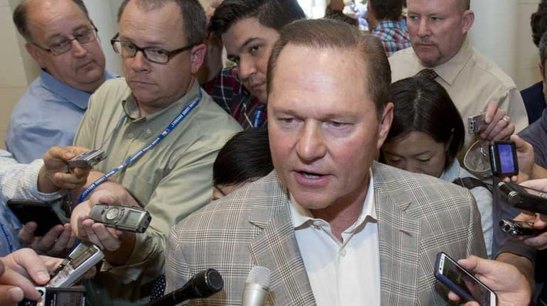 Sports agent Scott Boras, center, speaks to reporters at the...