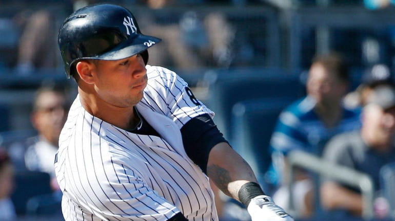 New York Yankees designated hitter Gary Sanchez (24) hits an...