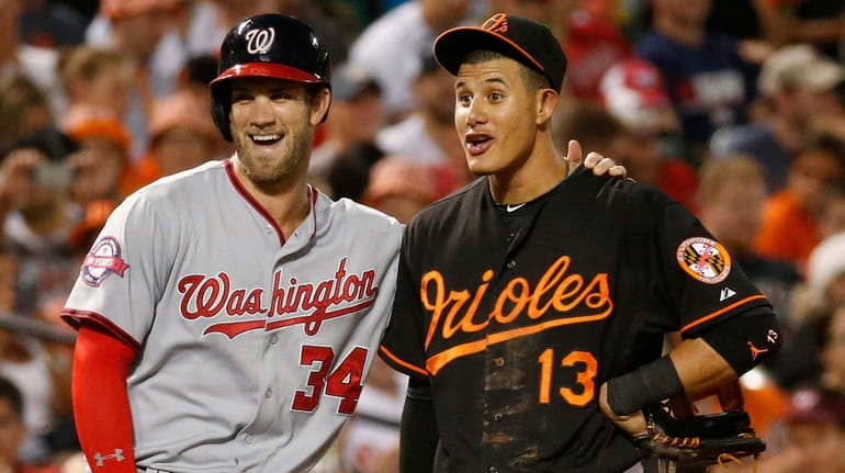 Free agents Bryce Harper, left, and Manny Machado are expected to...