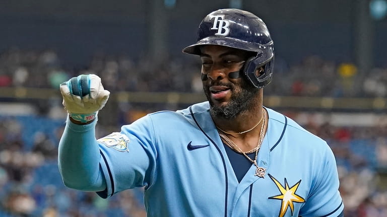Tampa Bay Rays' Yandy Diaz reacts after his solo home...