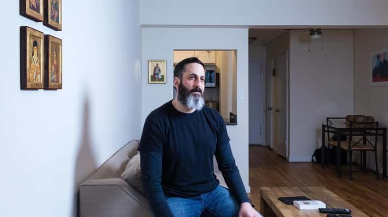 Nick Mavromoustakos, 42, in his Long Beach studio apartment.