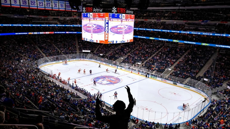 Islanders fans watch their team in action at their new...