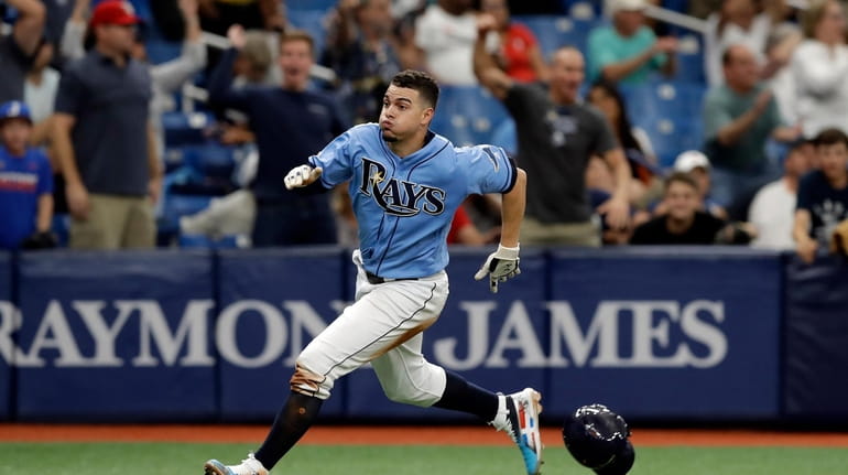 Tampa Bay Rays' Willy Adames races home to score what...