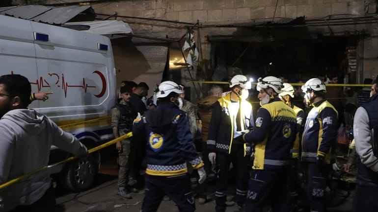 In this photo provided by the Syrian Civil Defense White...
