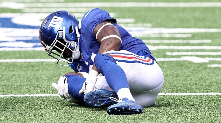 Jabrill Peppers of the Giants is injured in the first quarter...