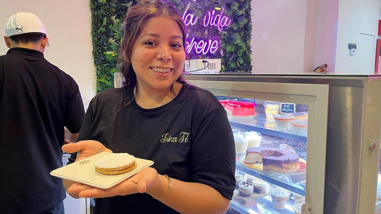 Marjory Moreno holds one of her alfajores at her Peruvian...