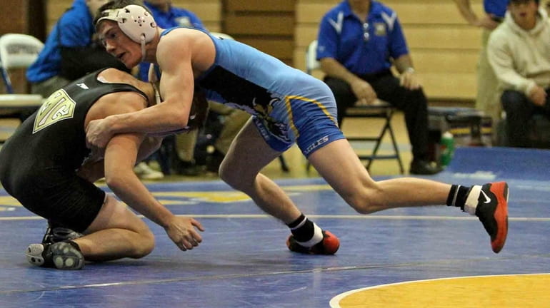 Hauppauge's Nick Mauriello, right, wrestles St. Anthony's in December. (Dec....