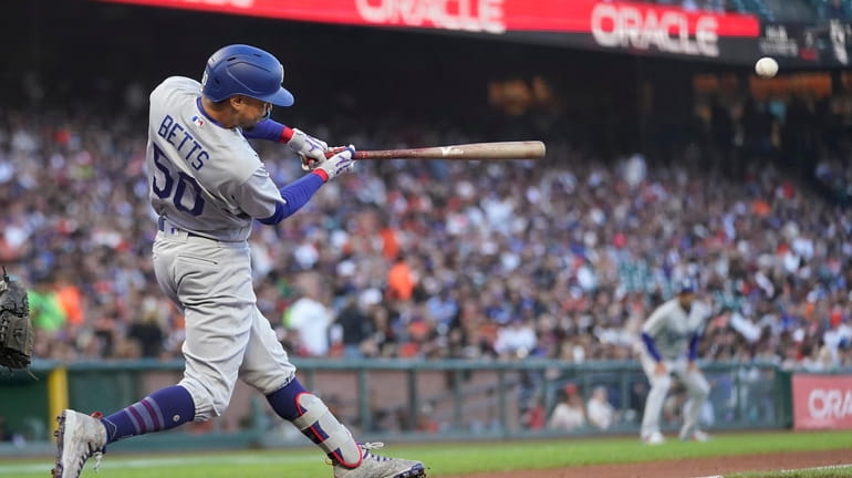 Los Angeles Dodgers' Mookie Betts hits a double against the...