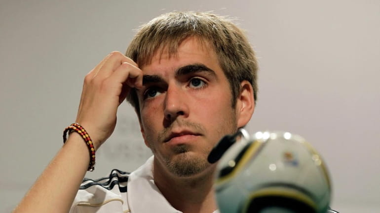 Germany's team captain Philipp Lahm speaks during a news conference...
