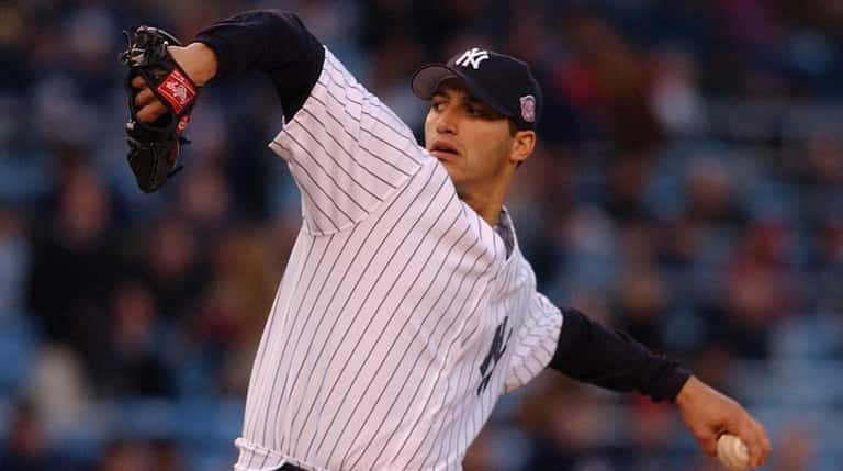 Yankees pitcher Andy Pettitte throws in a game against the...