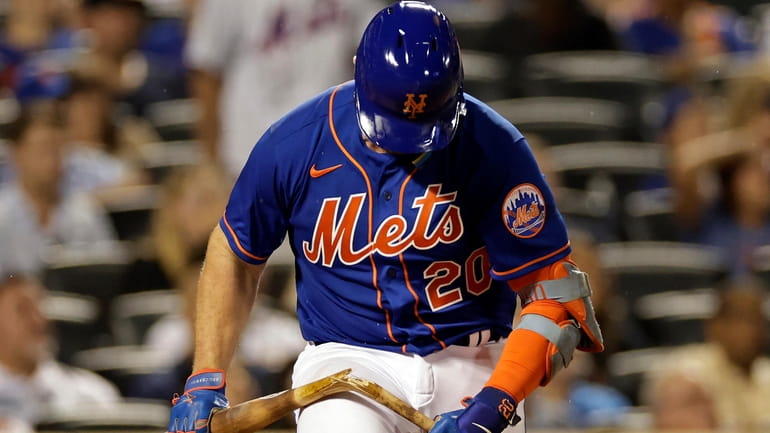 The Mets' Pete Alonso breaks his bat after flying out...