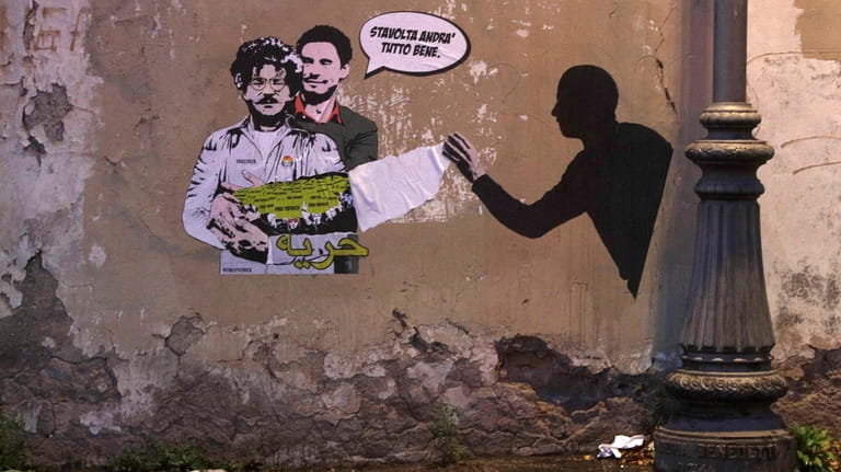 A mural depicts detained Egyptian human rights advocate and student...