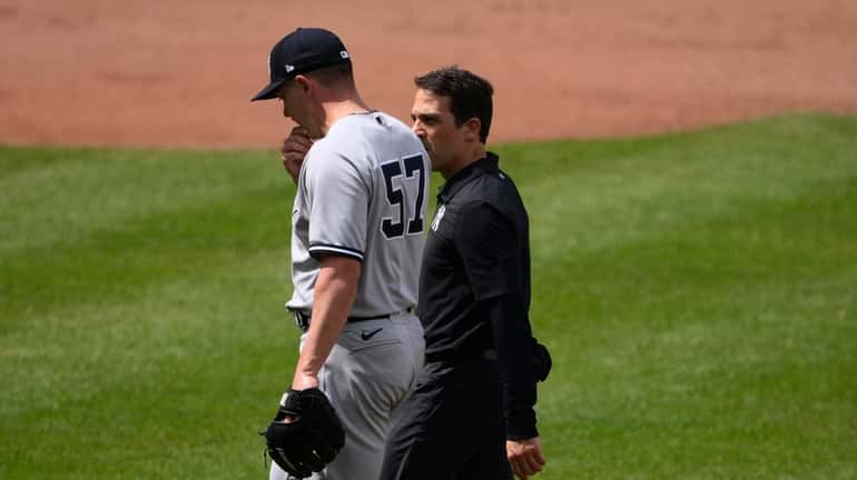 New York Yankees relief pitcher Chad Green (57) walks off...
