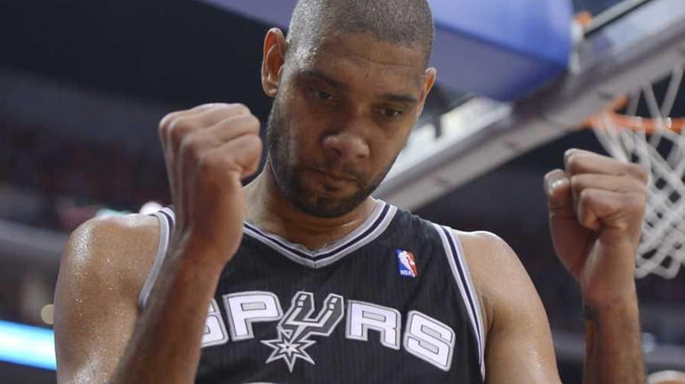 San Antonio Spurs center Tim Duncan celebrates after scoring during...