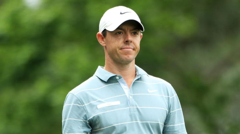 Rory McIlroy of Northern Ireland reacts on the fourth hole...