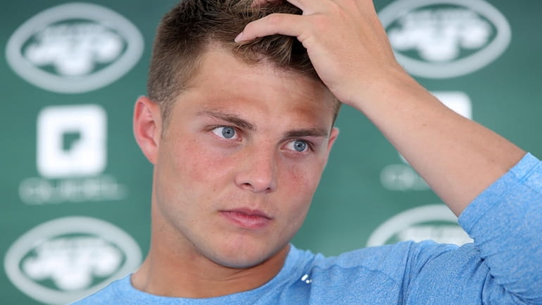 Jets quarterback Zach Wilson talks to the media during training camp at...