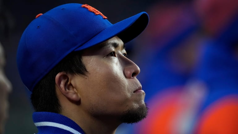 Mets starting pitcher Kodai Senga sits in the dugout during...