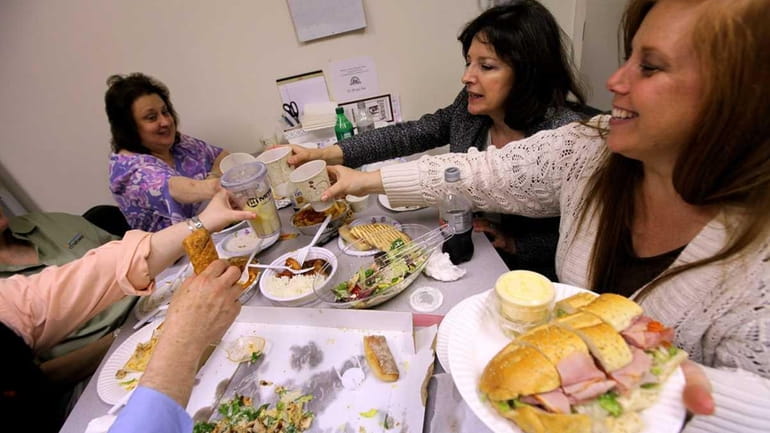 Employees at CT Networks in Hauppauge toast over the lunch...