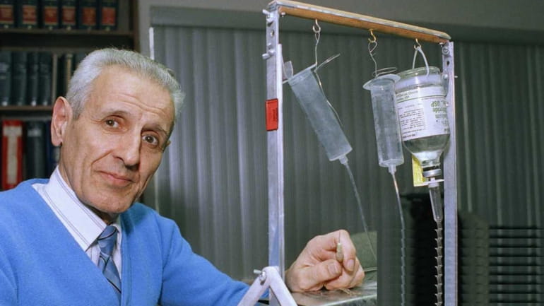 In a 1991 photo, Dr. Jack Kevorkian shows his "suicide...