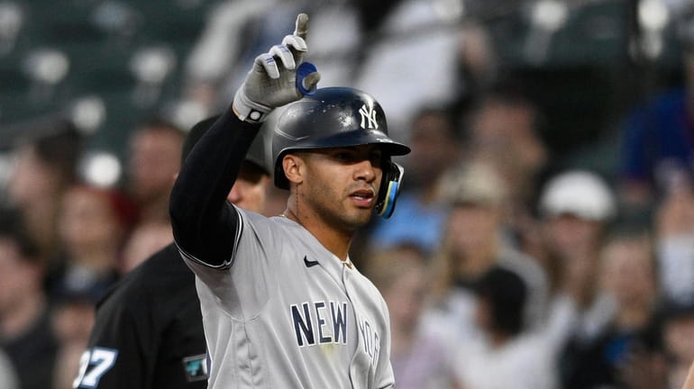 Yankees' Gleyber Torres gestures at first after he singled during...