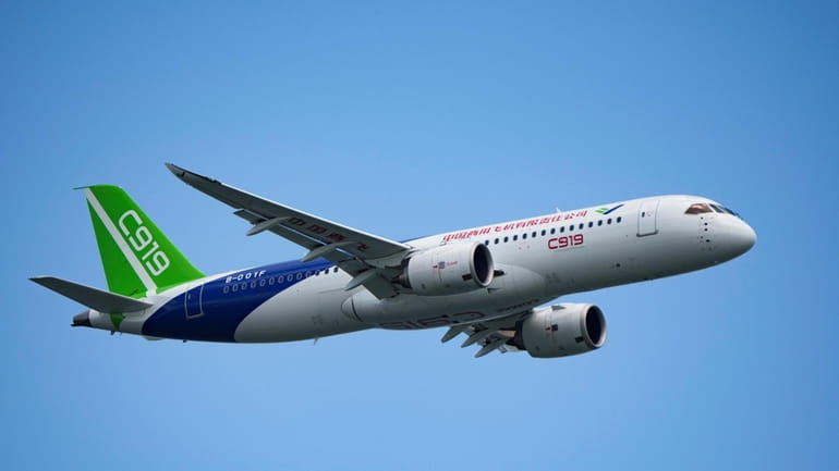 A China's Comac C919 aircraft performs during first day of...