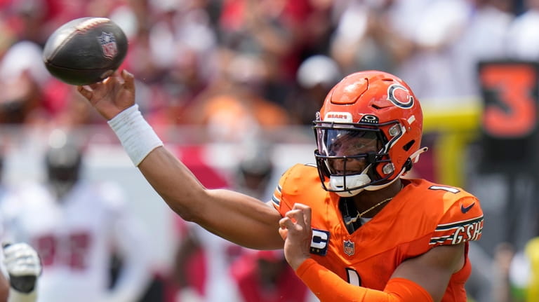 Chicago Bears quarterback Justin Fields (1) throws a pass during...