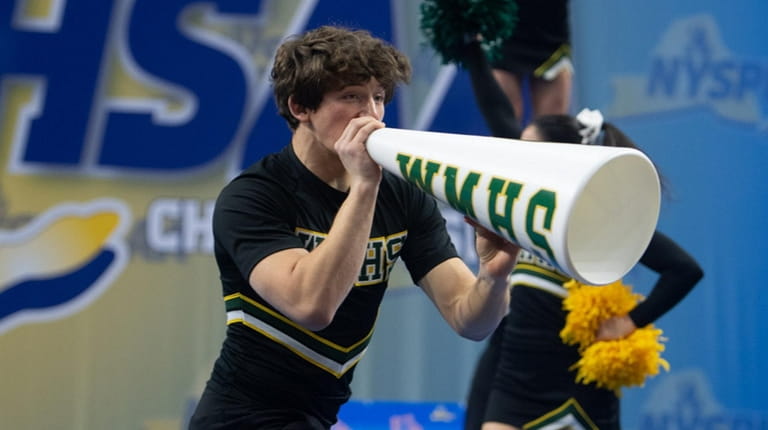 Ward Melville's Ian Licavoli competes in the NYSPHSAA cheerleading championship at Visions...