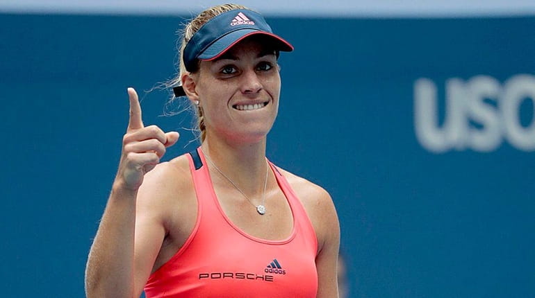 Angelique Kerber reacts after defeating Roberta Vinci in staight sets...