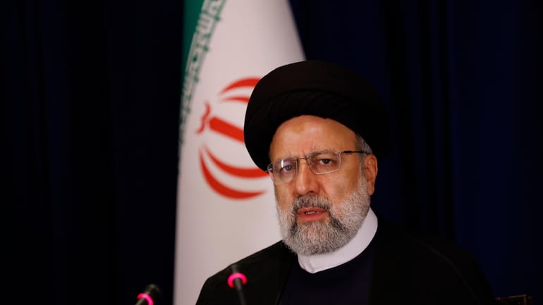 President of Iran Ebrahim Raisi speaks during a news conference,...