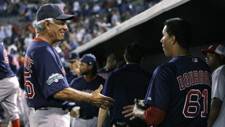 Boston Red Sox manager Bobby Valentine talks to Red Sox...