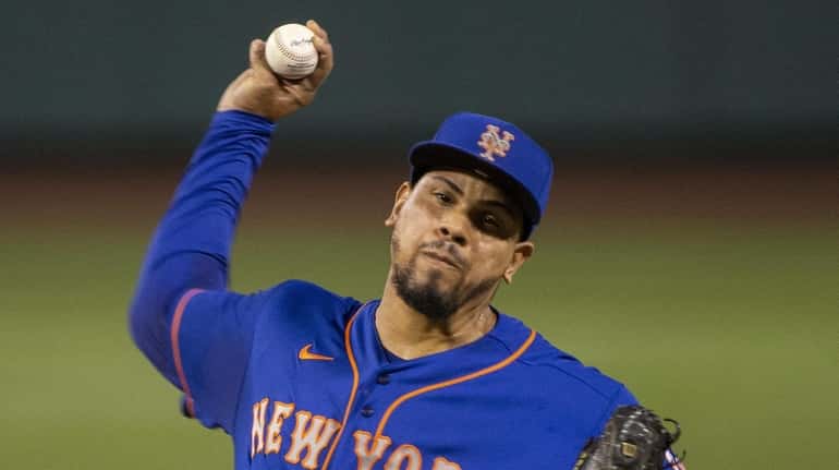 Mets relief pitcher Dellin Betances pitches during the eighth inning...