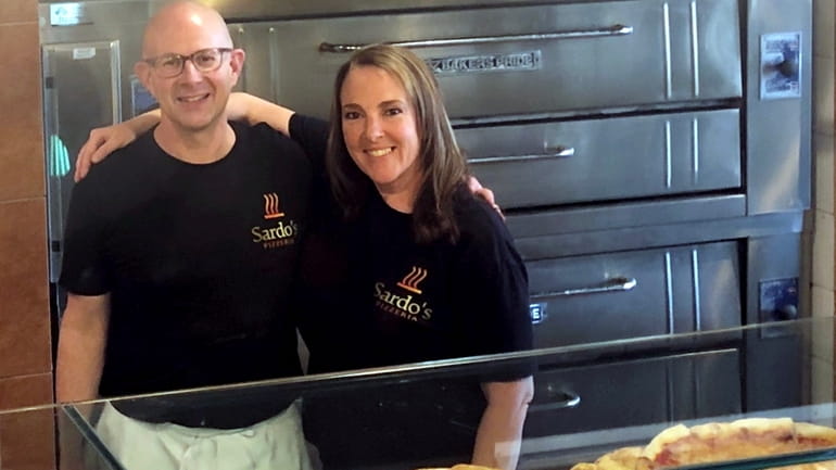 Craig Buchstein and Jennifer Rock bought Sardo's Pizzeria in Greenlawn...