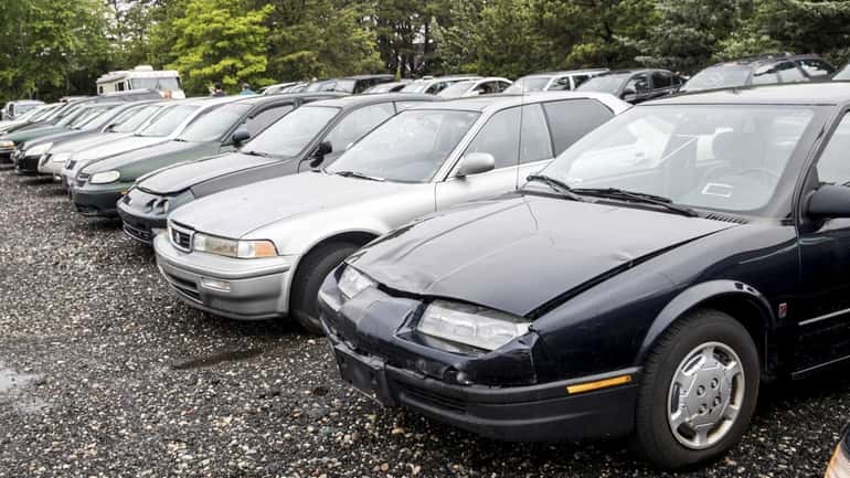 Cars are seen before the auction at the Suffolk County Police...