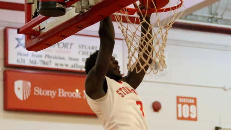 Stony Brook's Ahmad Walker dunks during a game against Maine....