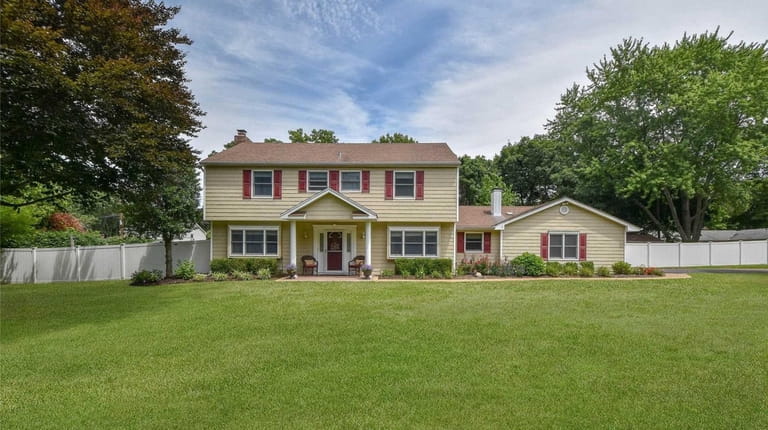 This four-bedroom Colonial, featuring two full bathrooms and two half...