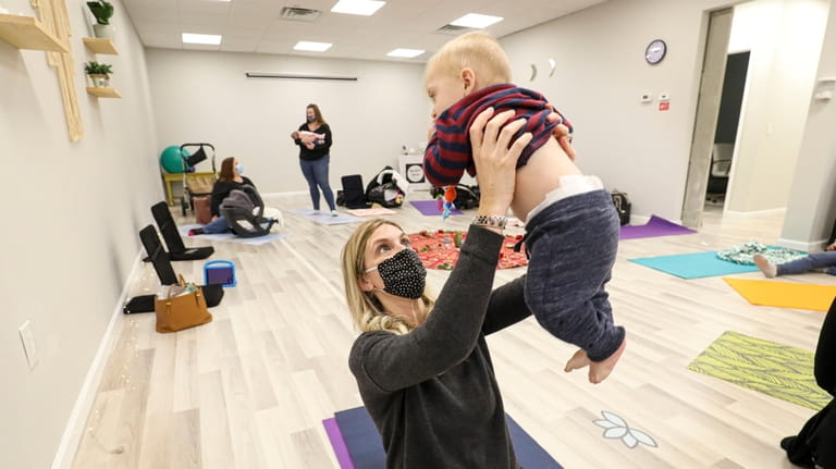 Avery Mischke, of Commack, and her son Kaden, 7-months, take...