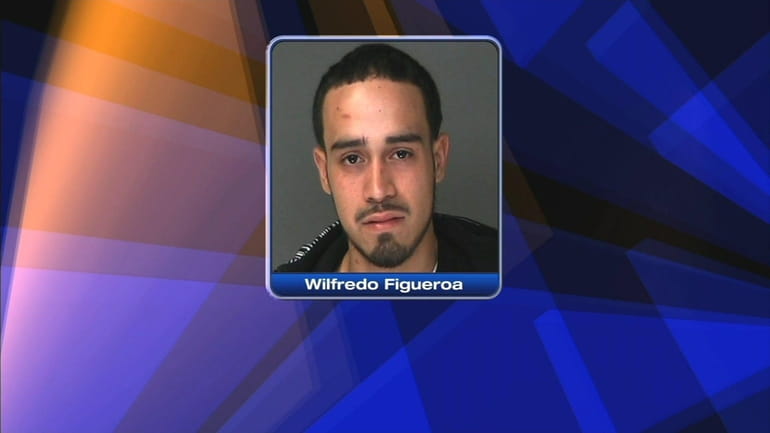 Police say Wilfredo Figueroa, of Ridge, blew a stop sign...