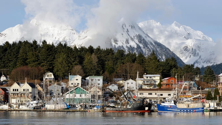 Homes in downtown overlook the harbor, in Sitka, Alaska, on...