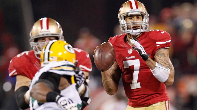 San Francisco 49ers quarterback Colin Kaepernick (7) looks for a...