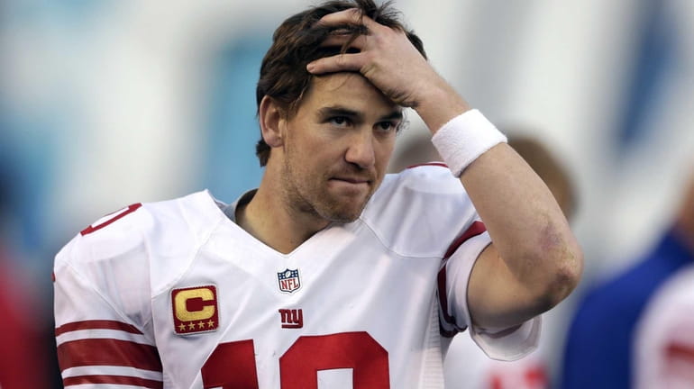 Eli Manning reacts on the sidelines in the closing minutes...