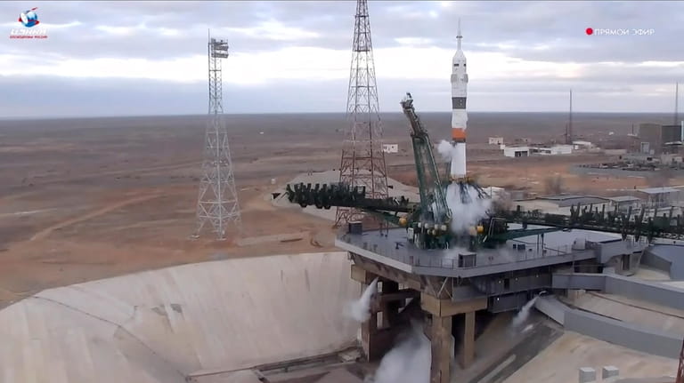 In this photo taken from video released by Roscosmos space...