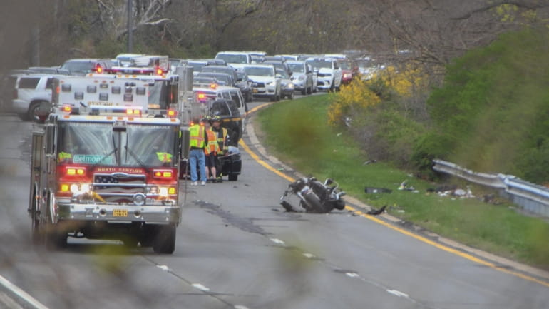 Police and firefighters respond to a crash on the westbound Southern State Parkway...