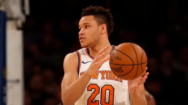 Kevin Knox #20 of the New York Knicks controls the...