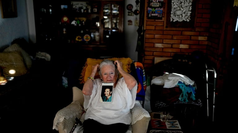 Nora Cortinas, 94, wears a photo of her disappeared son...