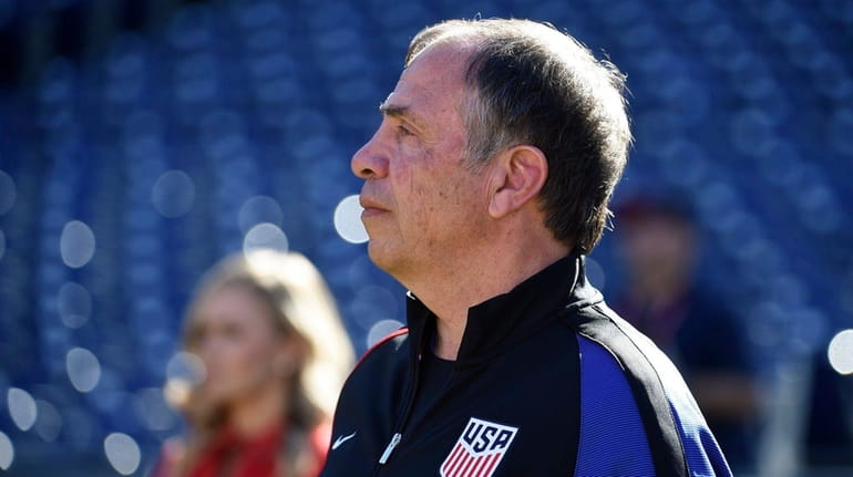 United States head coach Bruce Arena looks on from the...