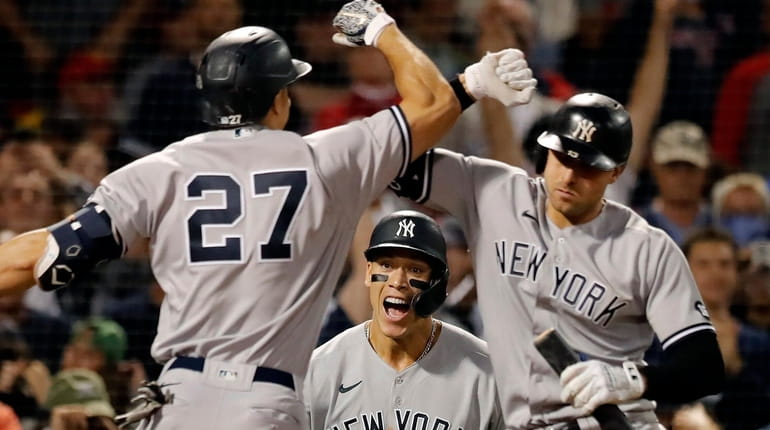 New York Yankees' Giancarlo Stanton celebrates his two-run home run...