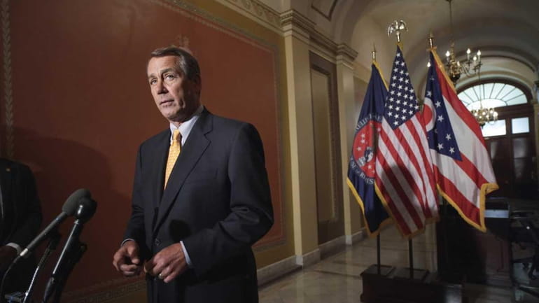 House Speaker John Boehner of Ohio speaks during a news...